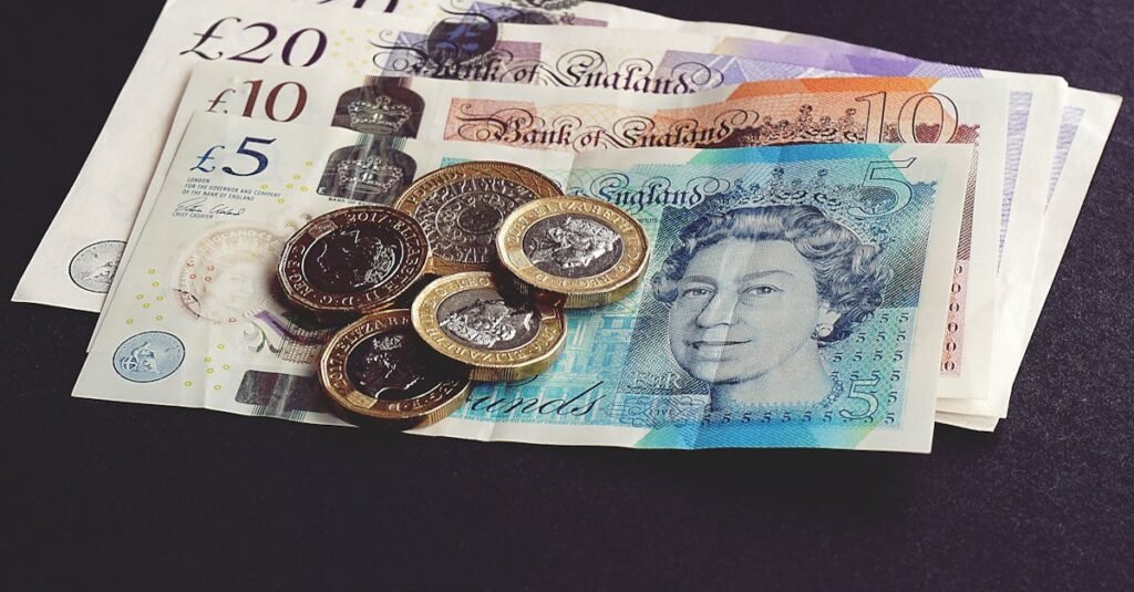 pexels photo 1791583 1791583 High-quality image of British pound notes and coins on a dark surface, showcasing currency detail.