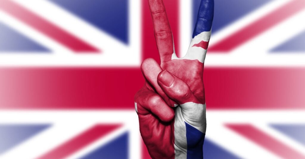 pexels photo 344775 344775 Illustration of a hand showing a peace sign with the UK flag background.