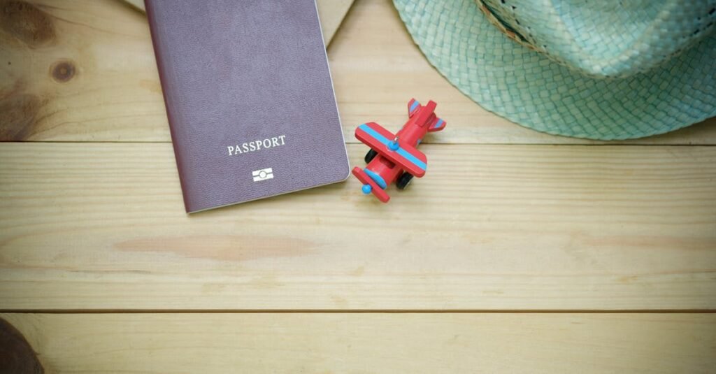 pexels photo 346798 346798 Flat lay of a passport, straw hat, and toy airplane on a wooden surface.