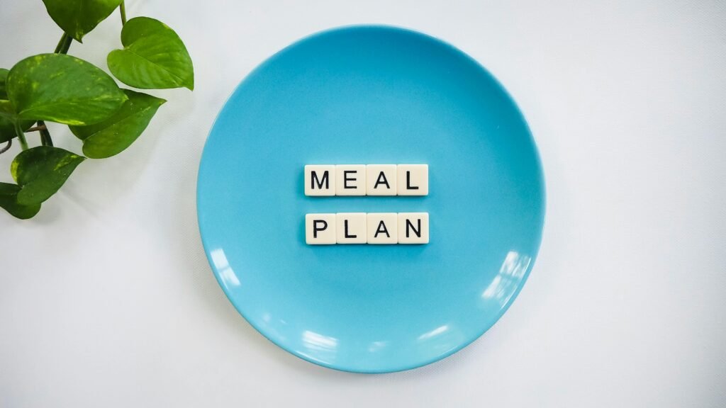 pexels photo 2377165 2377165 Innovative meal planning concept using alphabet tiles on a blue plate with green leaves. (University Meal Plans)