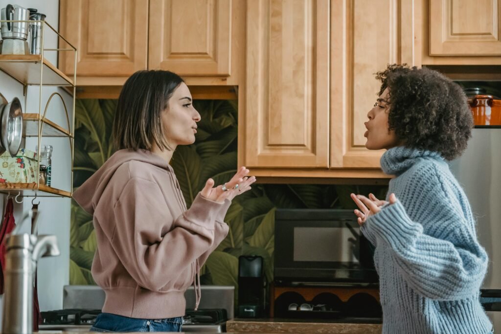 pexels photo 6383193 6383193 A heated discussion between two young women in a contemporary kitchen setting. (roommate conflicts)