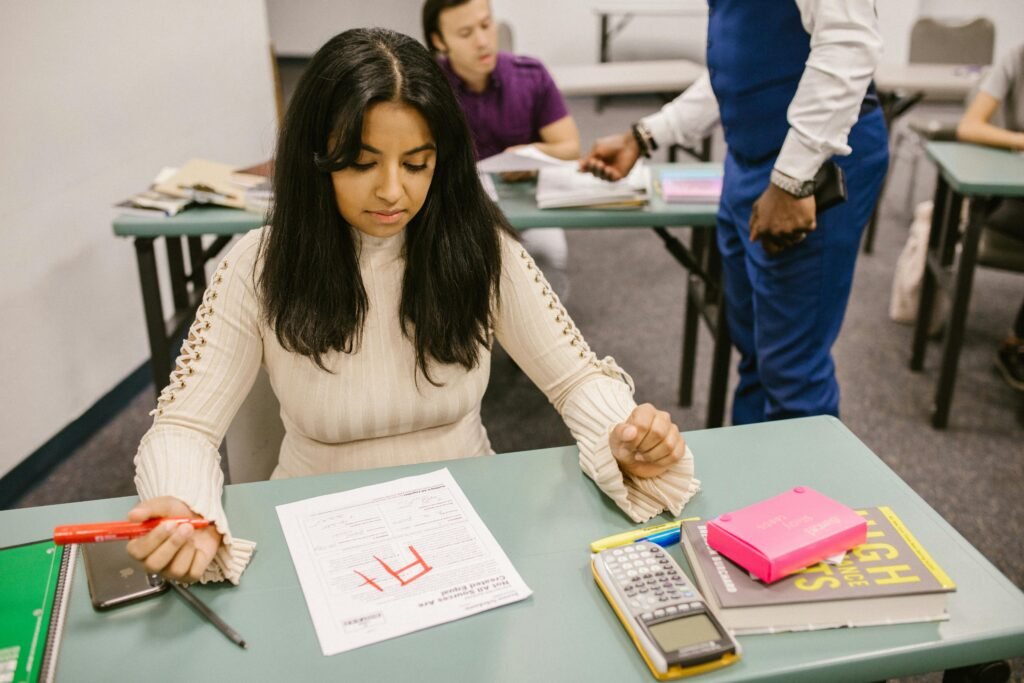 pexels-photo-7092548-7092548 A college student is given an F grade in a classroom setting during an exam.