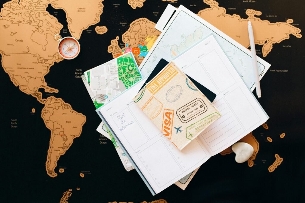 pexels photo 7235894 7235894 A flat lay of travel planning items on a map, featuring a compass, notebook, and guide for wanderlust enthusiasts.