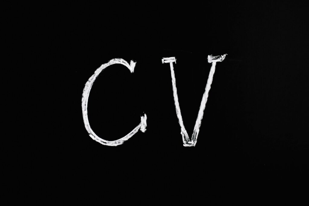 pexels-photo-5598290-5598290 Chalk text 'CV' on a black chalkboard. Ideal for resume or education-related themes.